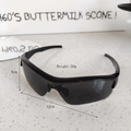 Front view of black sports sunglasses for kids with streamlined frame and dark lenses - Black