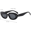 Black oval sunglasses with silver stud accents and wide temples in 45-degree view - Black