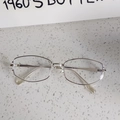 Detail of vintage 1960s butterfly style cat-eye glasses with silver metal and clear frame - Silver Frame Clear Lenses