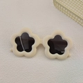 Detailed top view of cream floral children's sunglasses with dark protective lenses - White