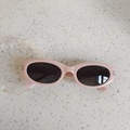 Pink oval frame sunglasses for kids with grey lenses and sparkling rhinestone accents - Pink