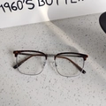 Detailed macro view of vintage semi-rimless glasses with tortoiseshell and silver metal frame - Tortoise Silver Clear Lens