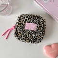 Detail view of leopard print plush cosmetic bag with pink brand label and cord - Black