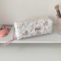 Detailed view of quilted cotton pencil case with cute puppy and bow patterns - White Corgi