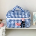 Detailed blue checkered quilted makeup bag with heart stitching and pink soft handle - Blue