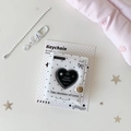 Detail of a 2-inch heart mini photo album with star chain and lobster clasp accessory - White