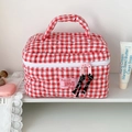 Detail of red gingham quilted makeup bag with heart stitching and double zipper handle - Rose Red