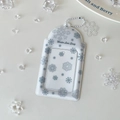 Detailed view of translucent PVC card holder with snowflakes and white beaded chain - White Snowflake