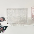 Macro detail of acrylic display stand featuring artistic water ripple texture - Double Slot Stand