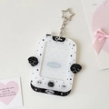 Close-up of starry acrylic photocard holder with wings and silver star keyring clasp - White
