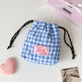 Detail of blue gingham quilted drawstring pouch with pink patch and heart embroidery - Blue