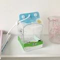 Detailed view of cow print milk carton PVC doll pouch with blue and green wave lanyard - Cartoon Milk Style