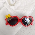 Kids heart shaped sunglasses in bright red with yellow bow accent and dark lenses - Bowknot Red