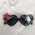 Kids heart shaped sunglasses with black frames and a red bow decoration on the side - Bow Black