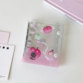 Close-up of mini 3-hole binder with pink gradient PVC cover and cute cat illustrations - Pink Apple