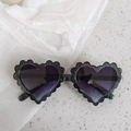 Sparkly black heart-shaped kids sunglasses with unique wavy glitter frame design - Pixel Glitter Black