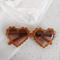 Amber heart-shaped sunglasses with gold glitter frame and wavy floral edges for girls - Pixel Tea