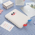 Detailed view of white plush laptop sleeve with embroidered cartoon face and soft lamb wool - Off White
