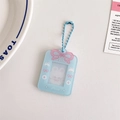 Detail of light blue acrylic photo card holder with pink bow and cartoon bunny motifs - Blue