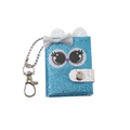 Detailed view of mini blue glitter notebook keychain with cartoon eyes and silver bow - Blue Owl Purple