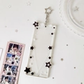 Detail of transparent acrylic 4-slot card holder with star patterns and heart decoration - Black White Star