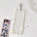 Detail of star-themed acrylic photo holder with heart lines and star-shaped silver hook - Yellow and Pink Stars