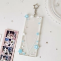 Detail of clear acrylic photo card holder with blue stars and star-shaped metal clasp - Blue and White Stars