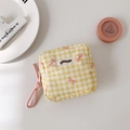 Detail of yellow gingham cosmetic bag with pink bow pattern and braided zipper pull - Yellow Plaid
