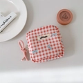 Detail of red checkered cosmetic pouch with blue butterfly print and zipper closure - Rose Red