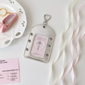 Detail of silver metallic balletcore photocard holder with heart clip and pink ribbons - Vertical