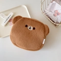 Close-up of soft brown plush bear makeup bag with cute embroidery on white desk - Brown