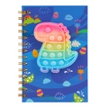 Close-up of dinosaur silicone pop-it sensory toy on blue cartoon spiral notebook cover - Dinosaur