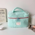 Mint green plush makeup bag with pink zipper and soft faux fur texture for storage - Green