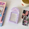 Detail of lavender photo card holder with bow and winter theme on a desk setup - Purple