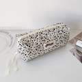 Detail of quilted cotton pencil case with ink splash pattern and Hisocute brand label - White (Black Splatter Style)