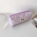 Close-up of quilted purple pencil case featuring ink splash patterns and ribbon zipper pull - Purple (Dotted Style)