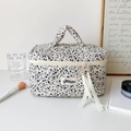 Portable cosmetic bag featuring black and white ink splash pattern and quilted fabric texture - Black