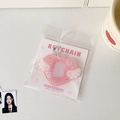 Detail of pink glitter heart-shaped photocard holder with wings and white bead chain - Pink