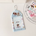 Gros plan du porte-carte Puppy Chef en PVC bleu clair avec chaînette blanche - Chien Bleu