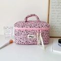 Pink quilted toiletry bag with black polka dots, top handle, and ribbon zippers - Rose Red