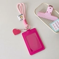 Pink PU leather ID card holder with woven lanyard and heart charm on white desk - Rose Red