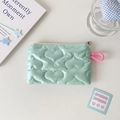Detail of mint green heart quilted pouch with metallic zipper and pink lanyard accessory - Heart Quilted / Mint Green