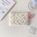 Detail of heart-quilted texture and pink zipper pull on minimalist cream storage bag - Heart Quilted / White