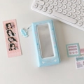 Detail view of light blue photocard album with wing pattern and cute cloud pendant - Blue