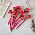 Macro shot of creative red silk rose flower pens with ribbon wrapped barrels as gifts - Rose Red