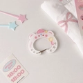 Close-up of bear-shaped acrylic carabiner with pink star detail and biscuit text - Little White Bear