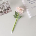 Detailed view of pink carnation ballpoint pen with green leaf stem on elegant desk - Champagne Pink