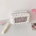 Close-up of plush white makeup bag with heart pattern and perfume window detail - White