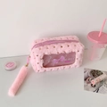 Detail of pink plush pouch with gold heart sequins, clear window and fluffy tail charm - Pink