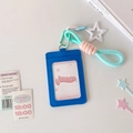 Close-up of blue faux leather card holder with star pendant and mint pink braided lanyard - Blue
